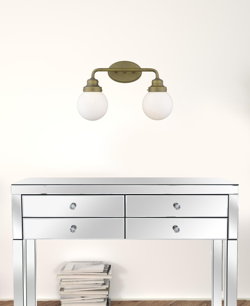 Two Light Gold Wall Sconce with Round Glass Shade HomeRoots