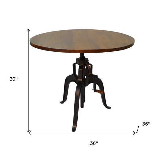 Adjustable Height Brown And Black Solid Wood And Iron Pedestal Base Round Top Dining Table HomeRoots