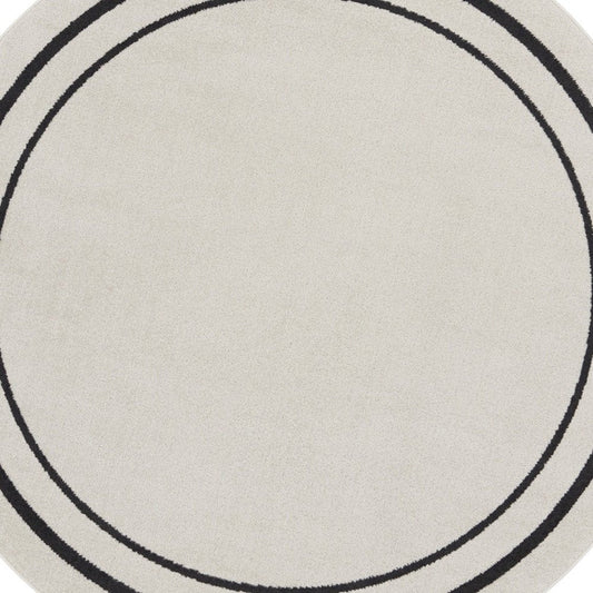 8' Ivory And Black Round Indoor Outdoor Area Rug