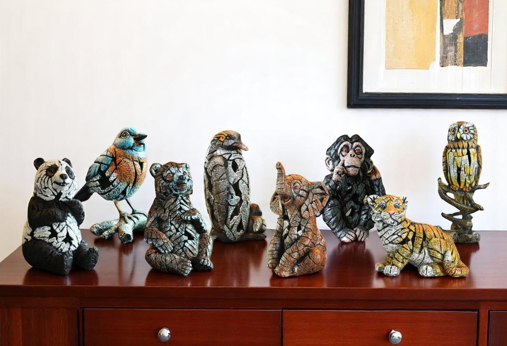 Set of Eight Brown White And Black Resin Panda, Bird, Bear, Monkey, Penguin, Elephant, Tiger, Owl Tabletop Sculpture HomeRoots