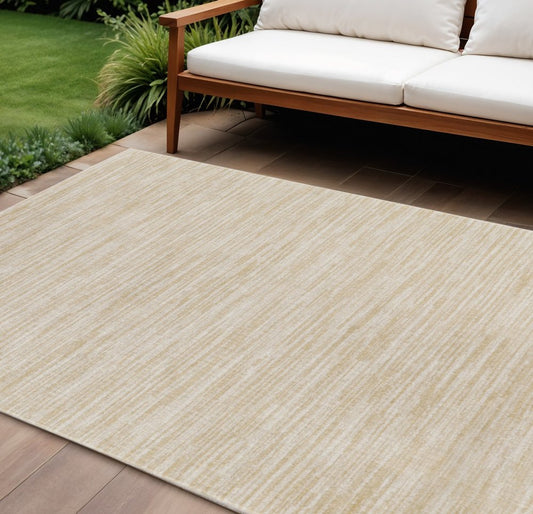 6' X 9' Ivory And Gold Abstract Indoor Outdoor Area Rug