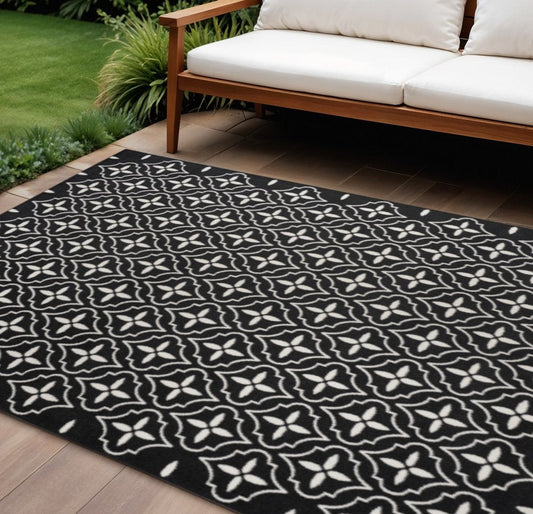 6' X 9' Black And Ivory Geometric Indoor Outdoor Area Rug
