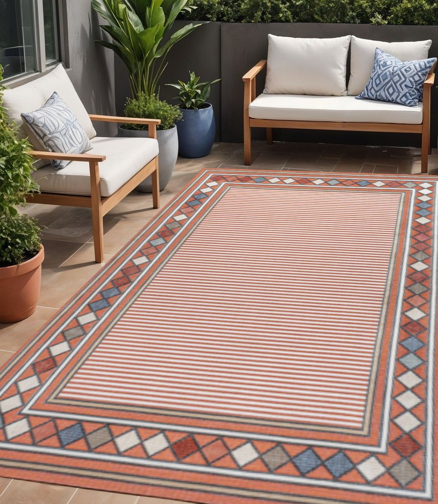 5' X 8' Orange And Ivory Geometric Indoor Outdoor Area Rug