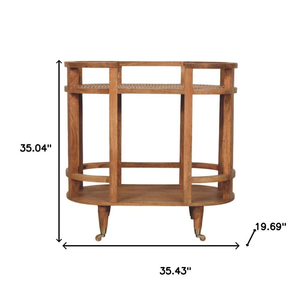 35" Golden Brown Rattan and Solid Wood Oval Wheel Console Table With Shelf HomeRoots