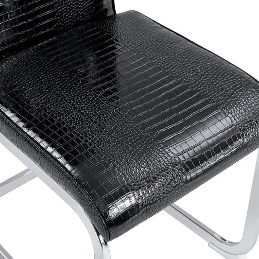 Set of Four Black And Silver Tufted Faux Leather And Metal Dining Side Chairs