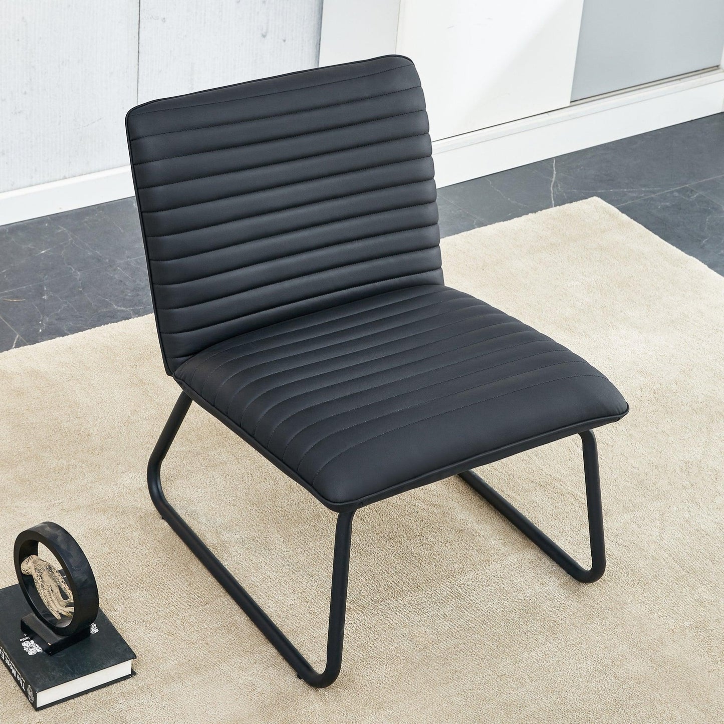 Black minimalist armless sofa chair with PU backrest paired with black metal legs - FurniFindUSA