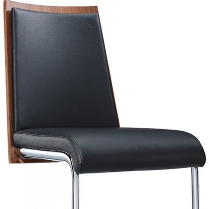 Set of Two Black and Silver Upholstered Faux Leather Dining Parsons Chairs HomeRoots