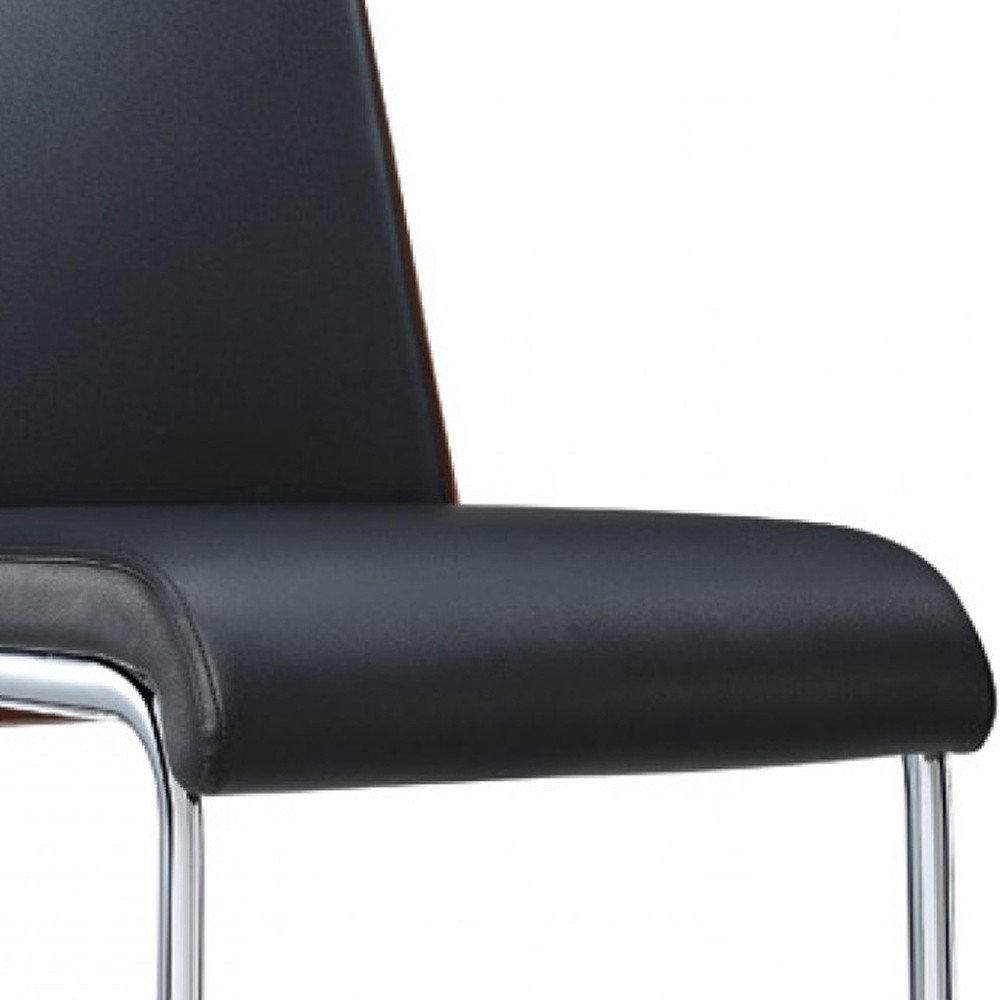 Set of Two Black and Silver Upholstered Faux Leather Dining Parsons Chairs HomeRoots