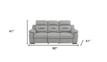 90" Gray Faux Leather Reclining Sofa With Brown Legs HomeRoots