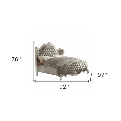 Gray and Bone Carved Scrollwork Solid Wood And Tufted Faux Leather Queen Bed Frame With Nailhead Trim HomeRoots