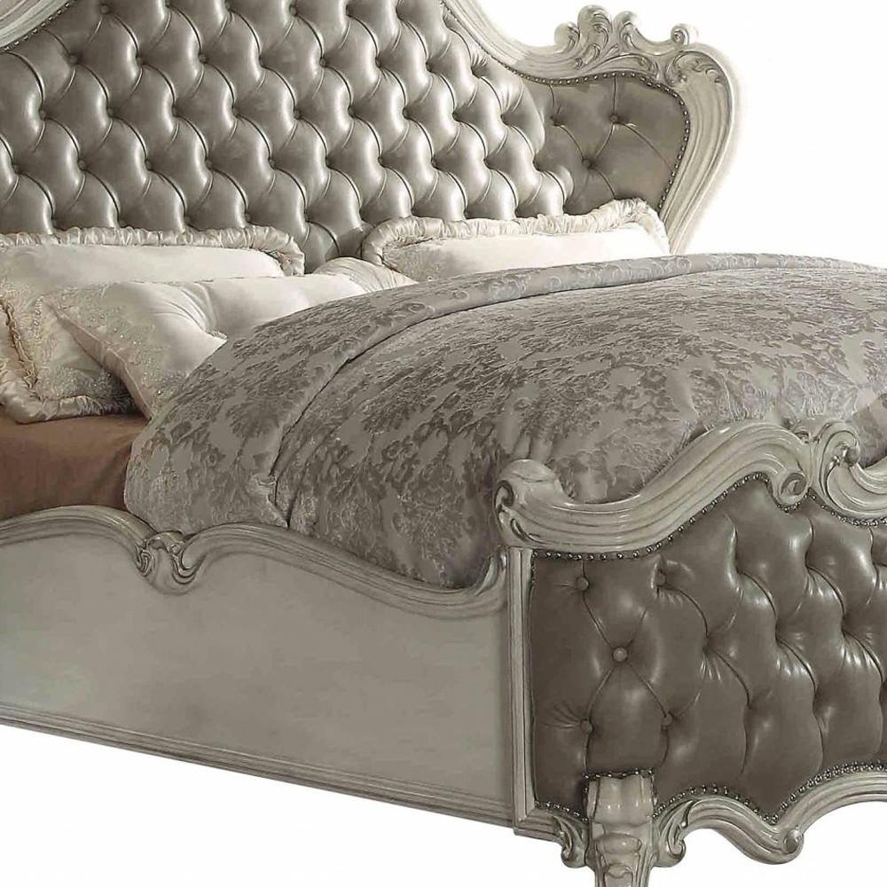 Gray and Bone Carved Scrollwork Solid Wood And Tufted Faux Leather Queen Bed Frame With Nailhead Trim HomeRoots