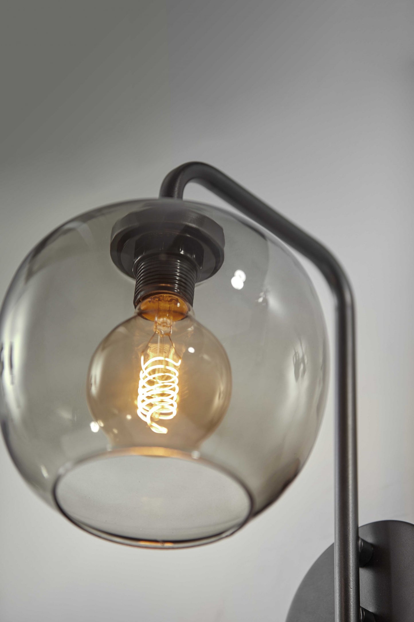 Smoked Glass Globe Shade With Vintage Edison Bulb And Matte Black Metal Wall Lamp