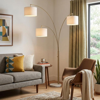 74" Brass Three Light Arc Floor Lamp With Off White Fabric Drum Shade HomeRoots