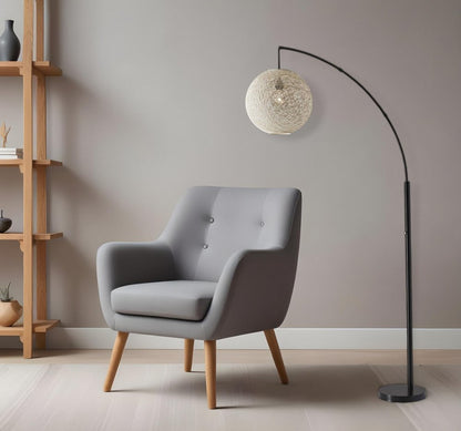77" Antiqued Bronze Arched Floor Lamp With Groovy Beige Abstract Wicker Globe Shade HomeRoots