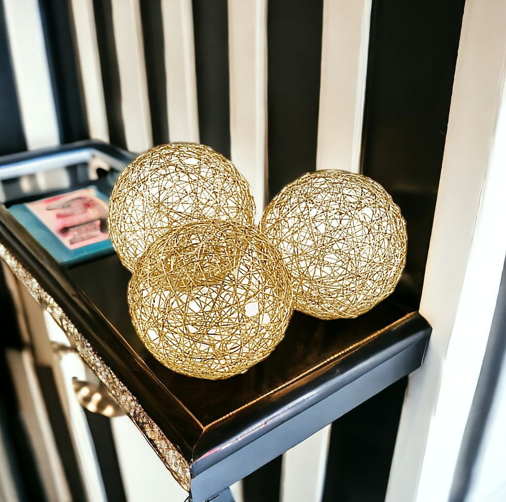 Set of Three Gold Aluminum Decorative Orbs