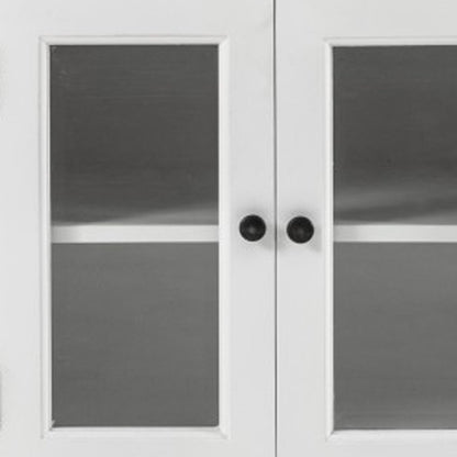 57" White Solid Wood Three Drawer Sideboard with Four Glass Doors HomeRoots