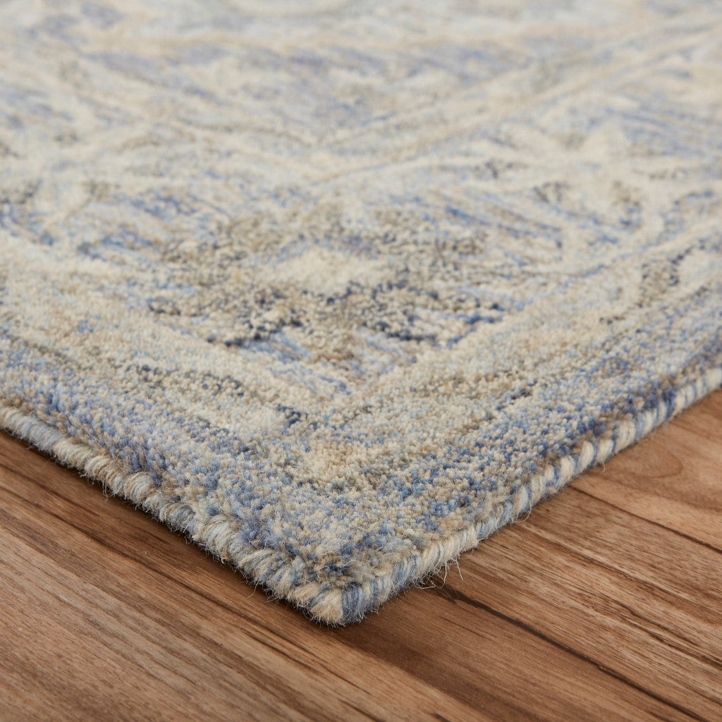 5’ x 8’ Blue and Tan Traditional Area Rug