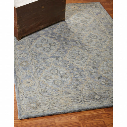 5’ x 8’ Blue and Tan Traditional Area Rug