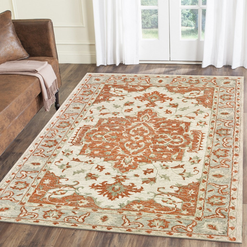 8’ x 10’ Orange and Ivory Medallion Area Rug