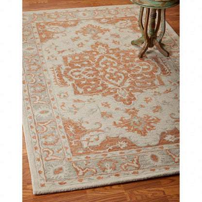 8’ x 10’ Orange and Ivory Medallion Area Rug