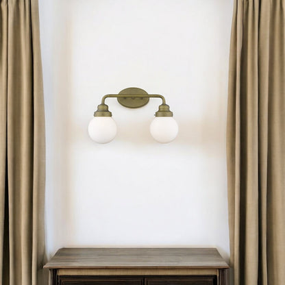 Two Light Gold Wall Sconce with Round Glass Shade