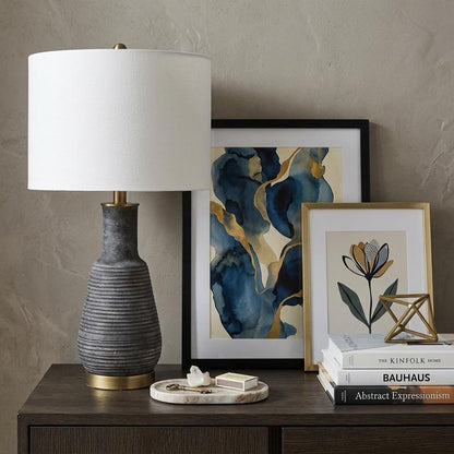 26" Distressed Black and Gold Ceramic Table Lamp With White Drum Shade HomeRoots