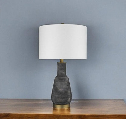 26" Distressed Black and Gold Ceramic Table Lamp With White Drum Shade HomeRoots