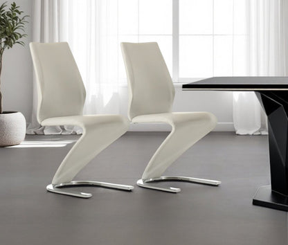 Set of Two White and Silver Upholstered Faux Leather Dining Side Chairs HomeRoots