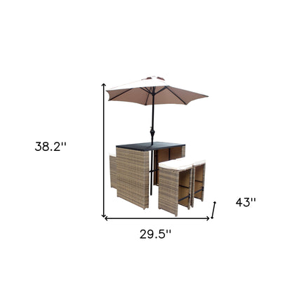 Six Piece Brown and Tan Faux Wicker Outdoor Bar Height Table Set with Umbrella and Stools