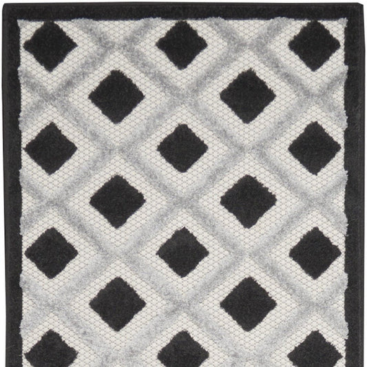 10' Black And White Indoor Outdoor Runner Rug