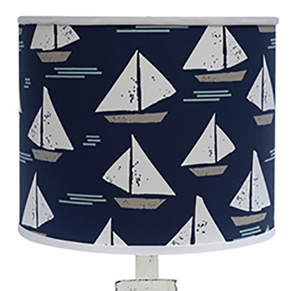 30" Distressed White Candlestick Table Lamp With Navy Sailboat Shade