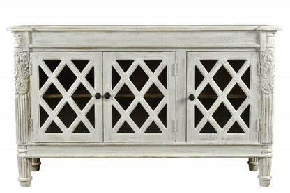 58" White Distressed Solid Wood Carved Scrollwork Sideboard with Three Glass Doors HomeRoots