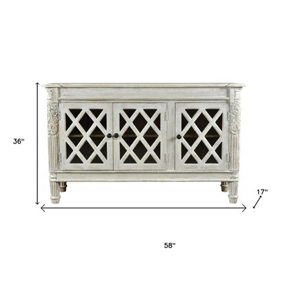 58" White Distressed Solid Wood Carved Scrollwork Sideboard with Three Glass Doors HomeRoots