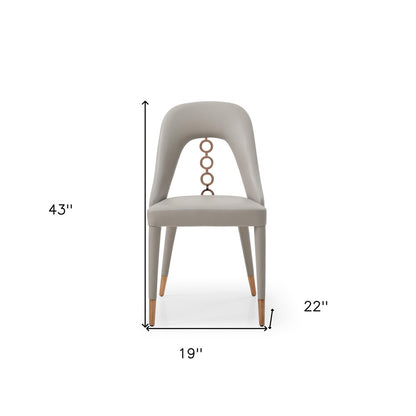 Set of Two Light Gray Faux Leather Dining Side Chairs With Rose Gold Accents HomeRoots