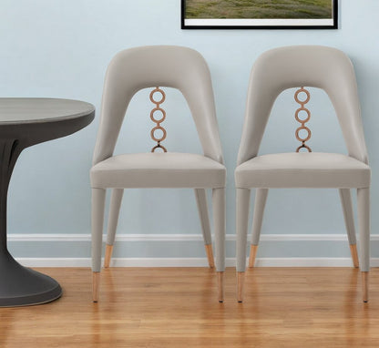 Set of Two Light Gray Faux Leather Dining Side Chairs With Rose Gold Accents HomeRoots