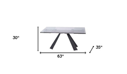 63" Clear And Black Glass And Metal Drop Leaf Pedestal Base Dining Table HomeRoots