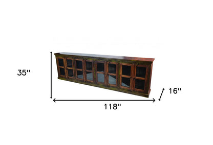 118" Brown Distressed Solid Wood Carved Abstract Buffet Table with 8 Glass Doors HomeRoots
