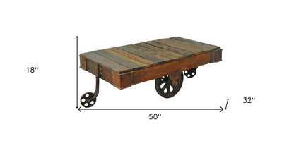 50" Brown and Black Solid Wood and Iron Distressed Wheel Coffee Table HomeRoots