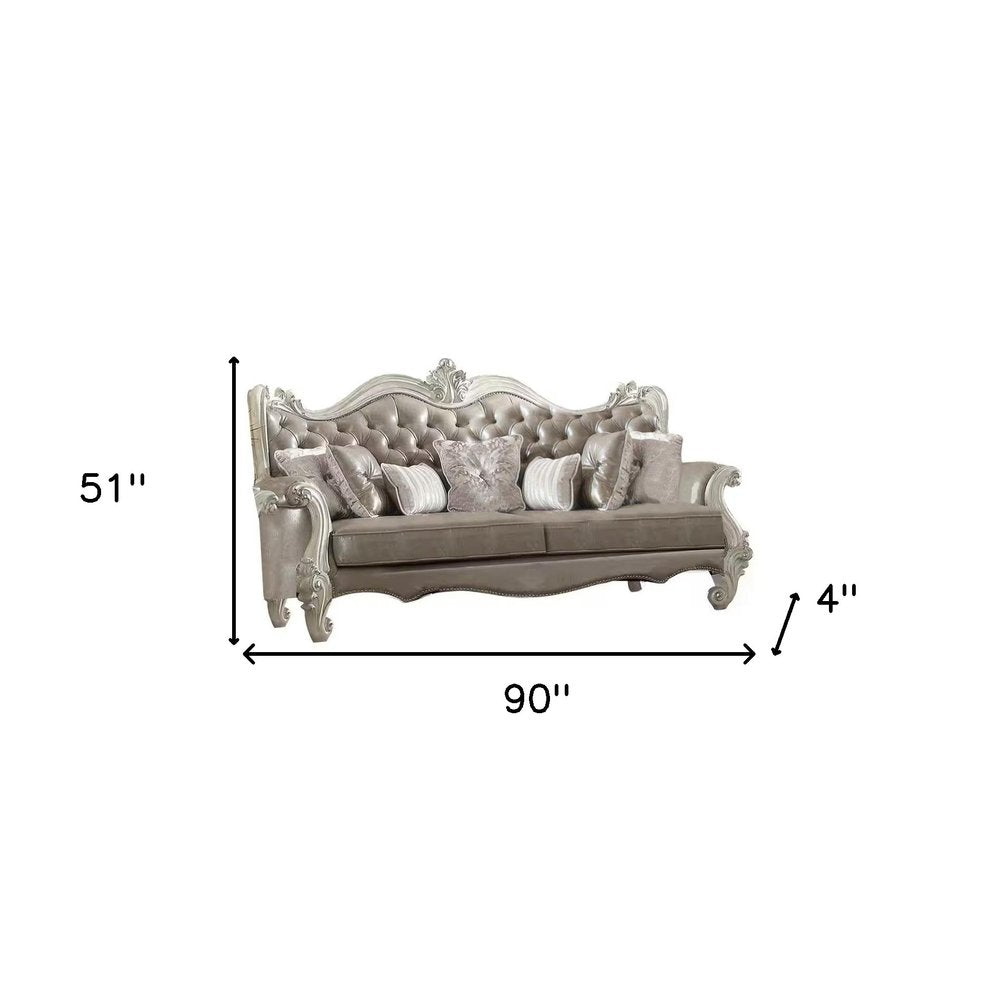 90" Gray Faux Leather Curved Sofa And Toss Pillows With Bone Legs HomeRoots