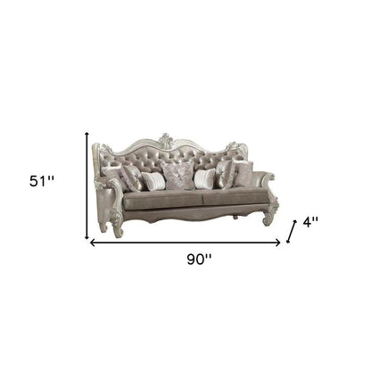 90" Gray Faux Leather Curved Sofa And Toss Pillows With Bone Legs HomeRoots