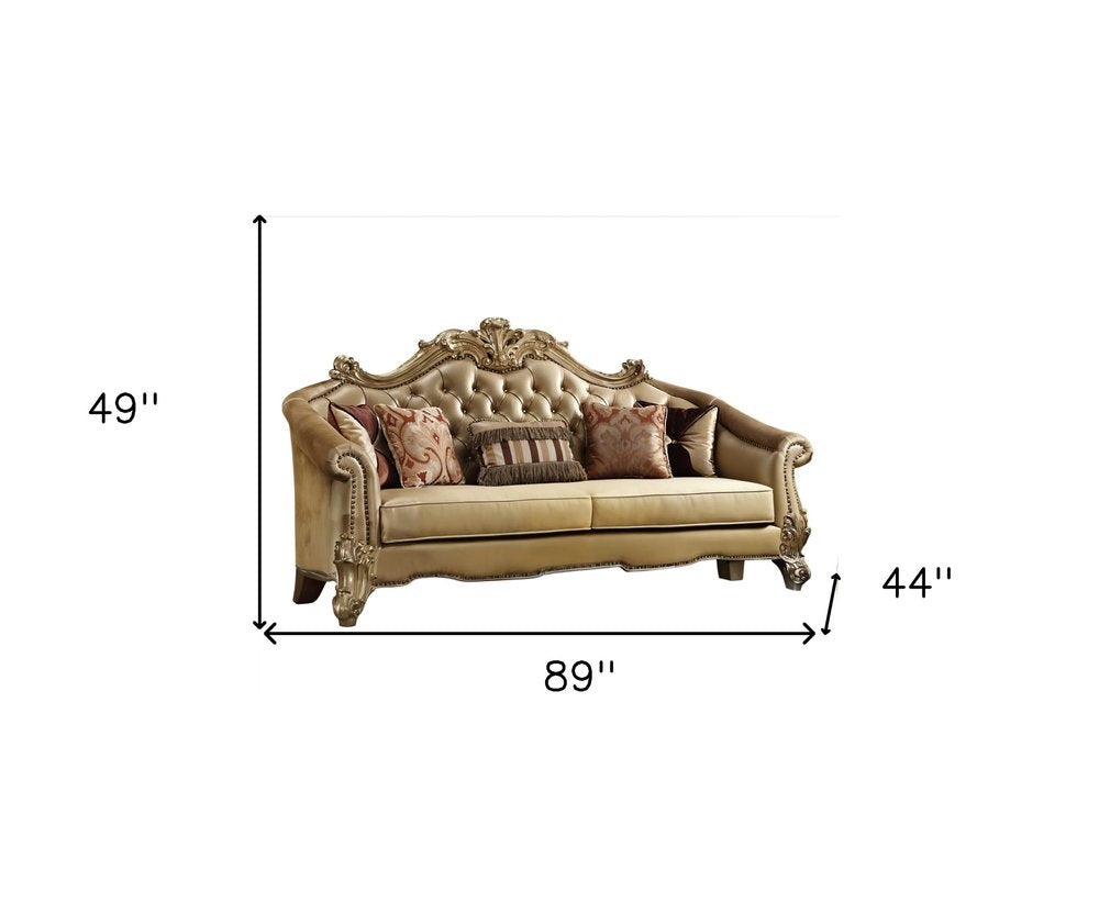 89" Bone Faux Leather Sofa And Toss Pillows With Gold Legs HomeRoots