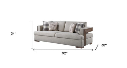 92" Beige Fabric Sofa And Toss Pillows With Brown Legs HomeRoots