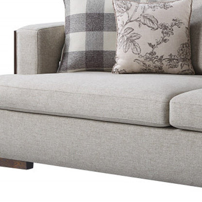 92" Beige Fabric Sofa And Toss Pillows With Brown Legs HomeRoots