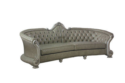 113" Bone Faux Leather Sofa And Toss Pillows With White Legs HomeRoots