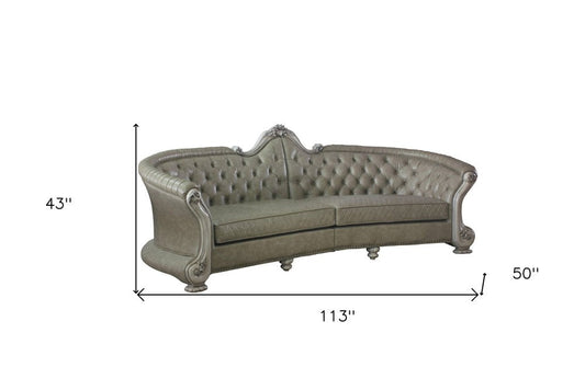 113" Bone Faux Leather Sofa And Toss Pillows With White Legs HomeRoots