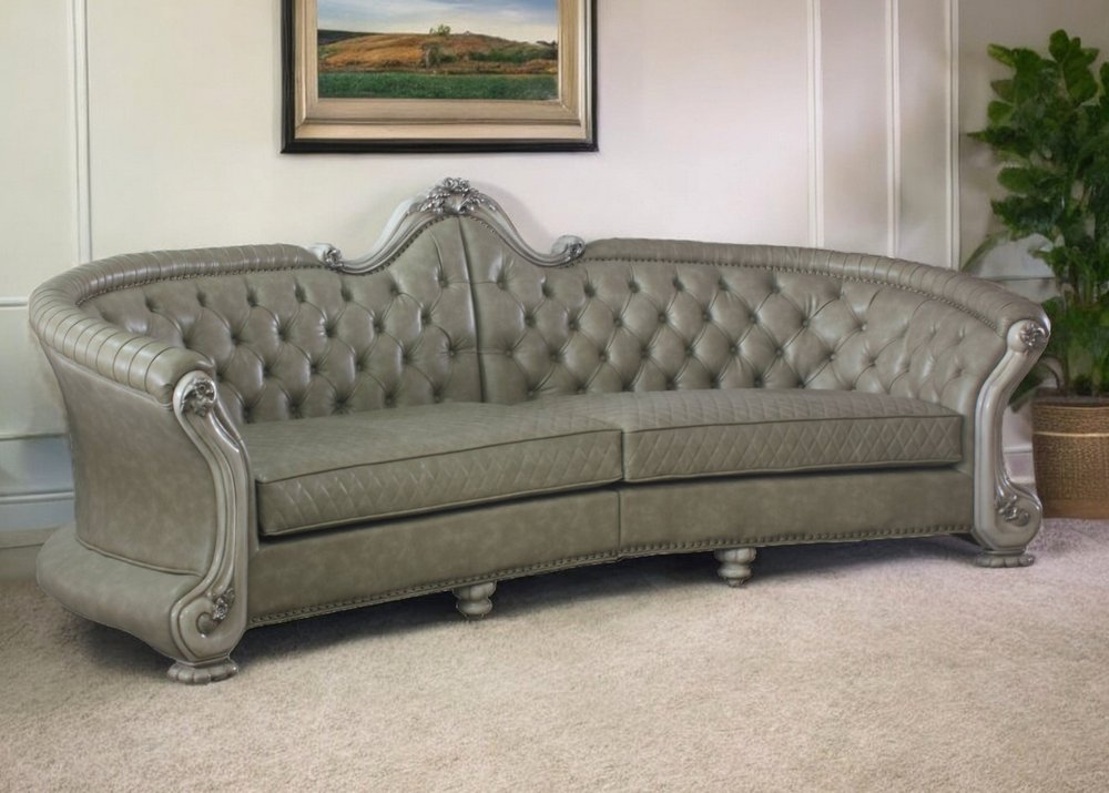 113" Bone Faux Leather Sofa And Toss Pillows With White Legs HomeRoots