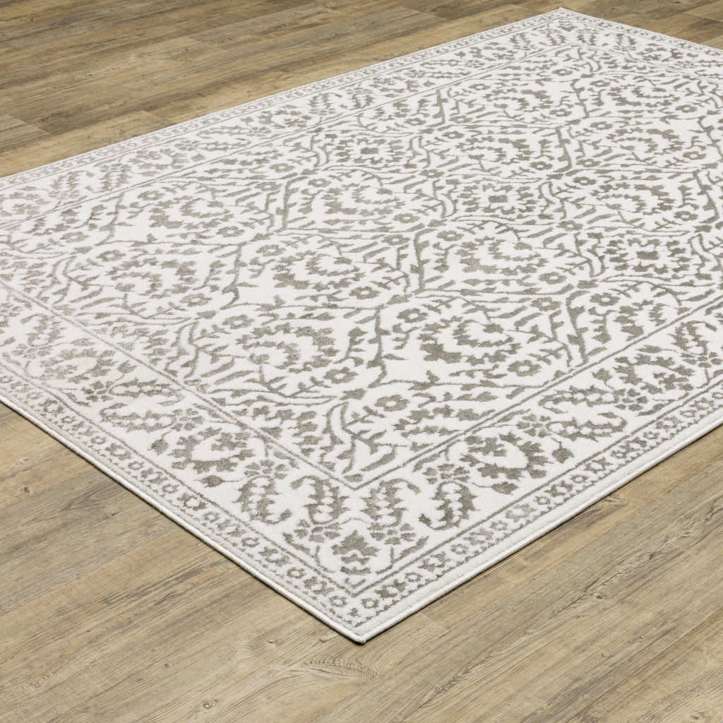 10' X 13' Grey And White Floral Power Loom Stain Resistant Area Rug