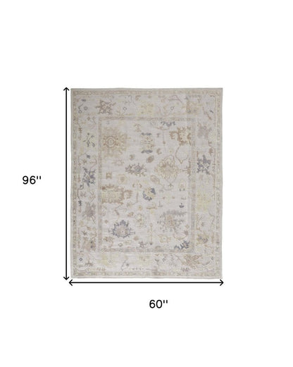 8' X 10' Tan Ivory And Orange Floral Hand Knotted Stain Resistant Area Rug
