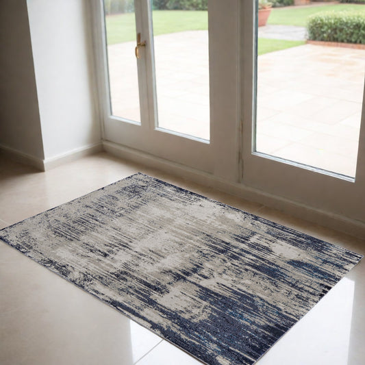 2' X 3' Blue and Ivory Abstract Power Loom Distressed Area Rug