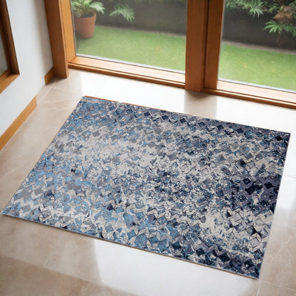 2' X 3' Blue and Ivory Abstract Power Loom Distressed Area Rug